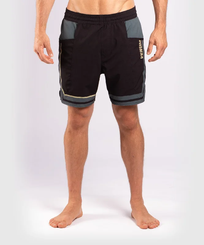 Men's side - stripe track shorts for a sporty running lookShort de Bain Venum Bali – Noir Men's side - stripe track shorts for a sporty running lookShort de Bain Venum Bali – Noir