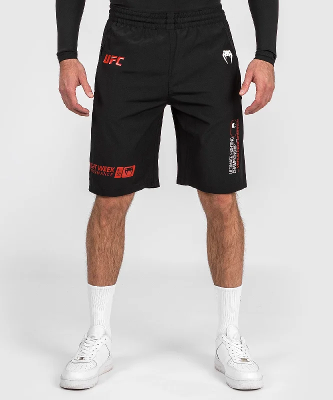 Men's high - waisted swim shorts with UPF protection for beach vacationsShorts de performance pour Hommes UFC Adrenaline by Venum Fight Week - Noir Men's high - waisted swim shorts with UPF protection for beach vacationsShorts de performance pour Hommes UFC Adrenaline by Venum Fight Week - Noir
