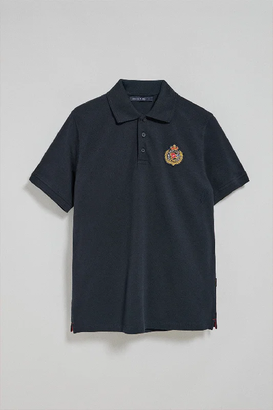 Men's quick - dry polo shirts for water sports activitiesPolo Nautic azul marino con detalle de parche naútico en el pecho