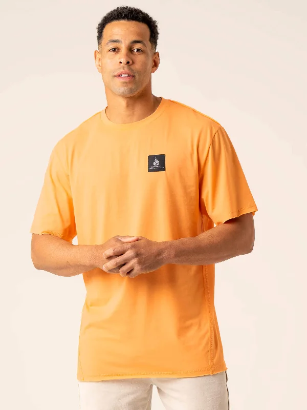 Men's moisture - wicking athletic t - shirts for intense workoutsDynamic Oversized T-Shirt - Orange Sherbet